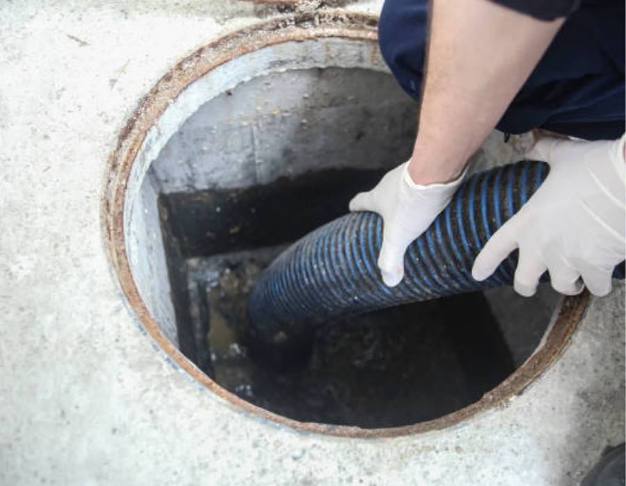 Plumber clearing clogged drain in Bountiful, UT using professional sewer cleaning hose