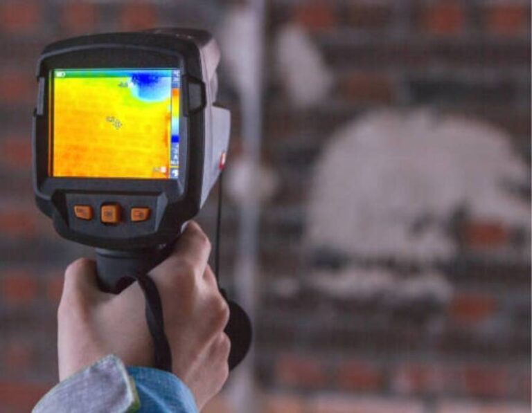Plumber using thermal imaging camera for expert leak detection in Kaysville homes